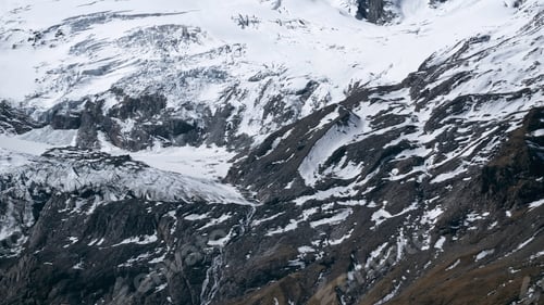 Preview: Alps cold mountain slopes. Creative. Snow and ice covered cliffs and rocks.