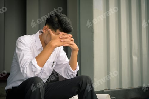 Preview: worried businessman sitting after losing job, stressed concept