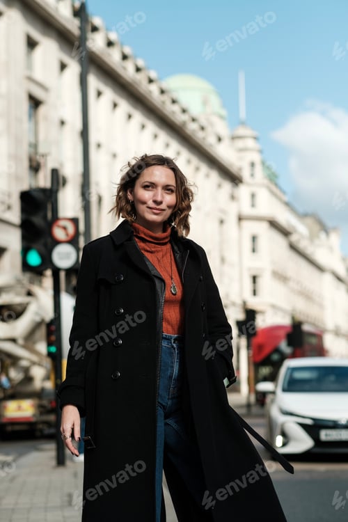 Preview: Confident caucasian woman looking away in a busy commercial day.