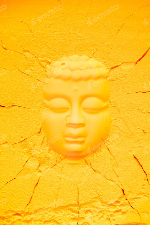 Preview: top view of buddha head shape on orange flour texture with cracks