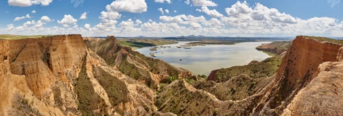Preview: Red clay erosion gully and river. Panoramic eroded landscape. Spain