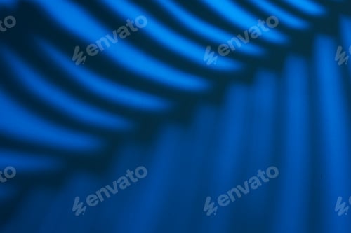 Preview: Beautiful monstera leaves shadow colored background in artificial light