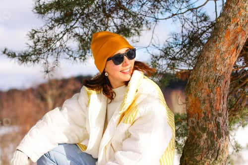 Preview: a woman in a good mood in winter on a walk., sunny day,