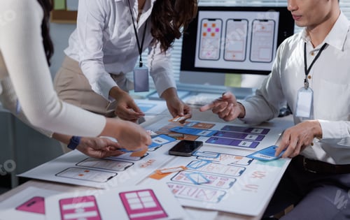 Preview: Ui ux designers collaborating on mobile app wireframe prototyping