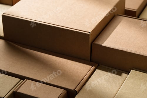 Preview: Stacked cardboard boxes arranged in a neat pattern under natural light