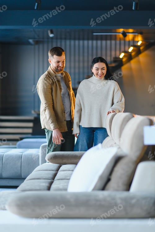 Preview: Couple shopping for new sofa in furniture store