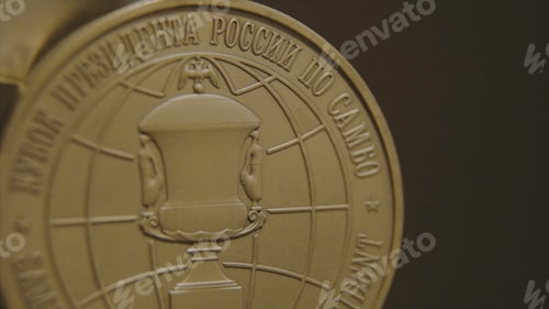 Preview: Gold medal with tricolor ribbons close-up. Medal for first place in the competition in judo. Medals