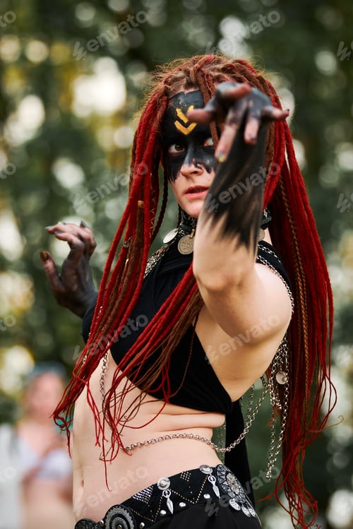 Preview: Mythological dancing girl faun on green lawn in public park outdoor art dancing event