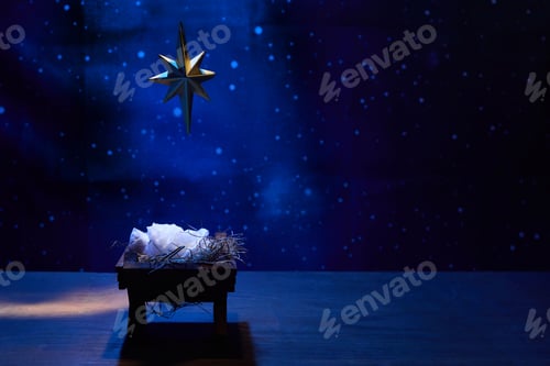 Preview: Starry Night Nativity. A nativity scene under a glowing star in a deep blue, starry background
