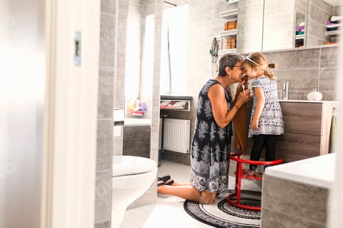 Preview: Grandmother and granddaughter (2-3) brushing teeth in bathroom