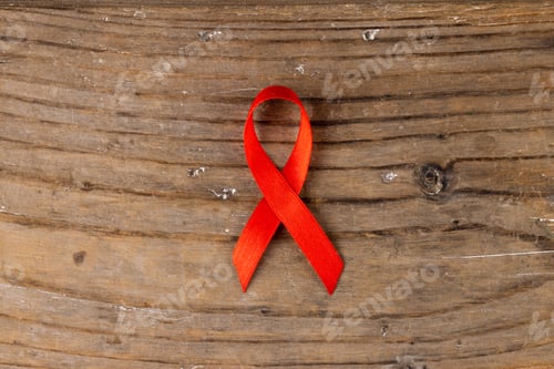 Preview: Image of red ribbon lying on wooden surface