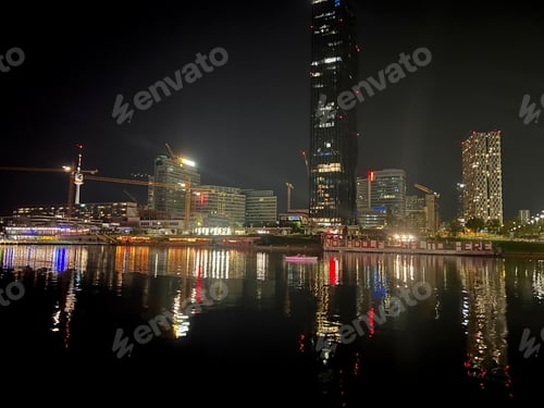 Preview: Night view to the bridge and night city over the river in Vienna, Austria
