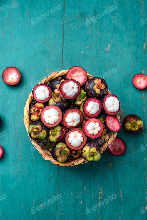 Preview: Mangosteen fruit on light blue wooden background,Tropical fruit