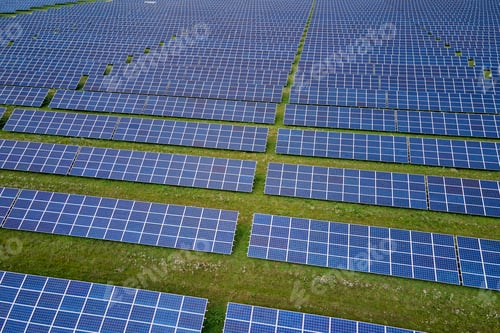 Preview: Aerial view of large sustainable electrical power plant with rows of solar photovoltaic panels