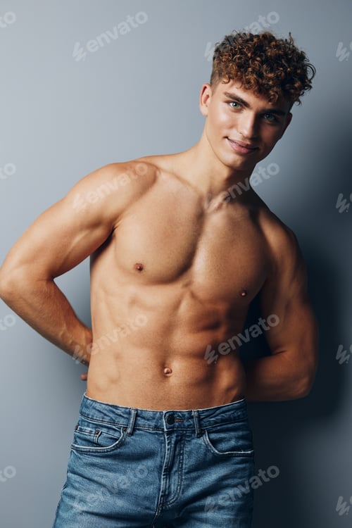 Preview: man strong standing jeans fit muscle sport athletic chest lifestyle bicep male