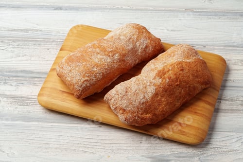 Preview: Two bread buns on wooden board close up