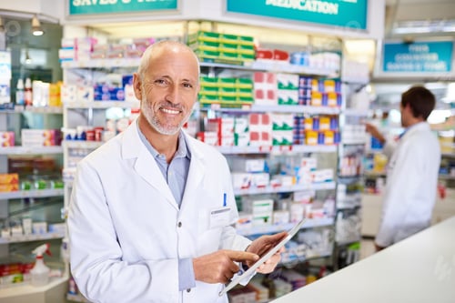 Preview: Portrait of a mature pharmacist using a digital tablet while in a chemist