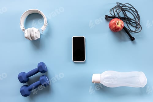 Preview: Sports equipment items on blue, flat lay.