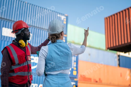 Preview: Foreman control loading Containers box from Cargo freight ship for import export.