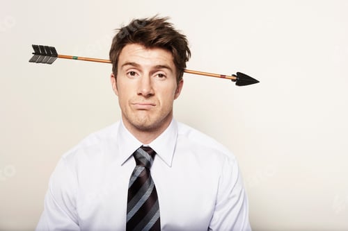 Preview: Business man with arrow through head
