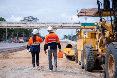 Preview: Engineers Surveyor wearing safety uniform ,helmet with equipment theodolite to measurement positioni