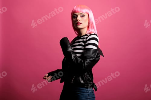 Preview: Portrait of female rocker with leather jacket and fun hairstyle