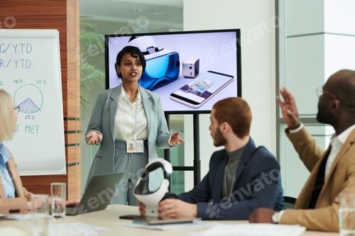 Preview: Confident coach or speaker making presentation in front of audience