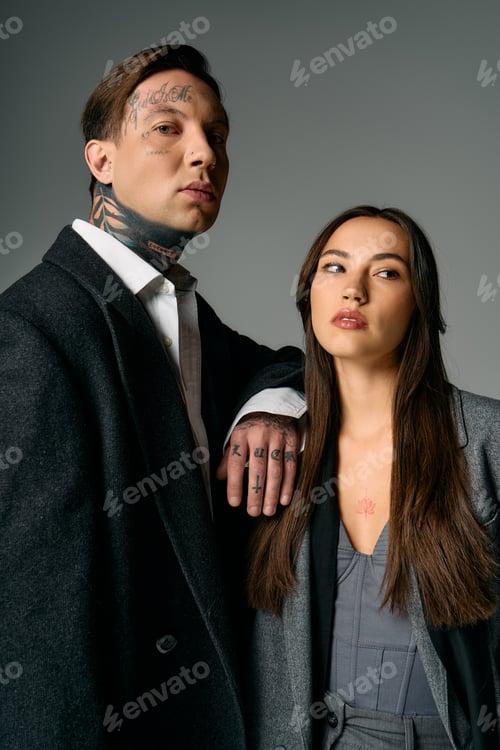 Preview: Young couple poses confidently in stylish attire against a minimalist backdrop in modern setting