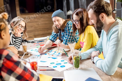 Preview: Group of people working together in the cafe