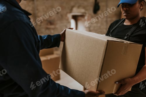 Preview: Delivery man handing box to customer