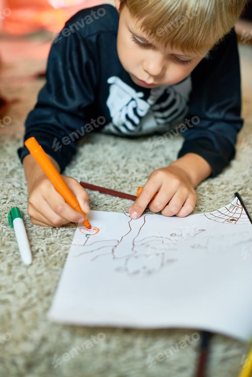 Preview: Little Boy Drawing Pictures on Halloween