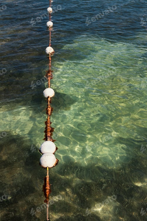 Preview: Floats in water marking the swimming area in the sea