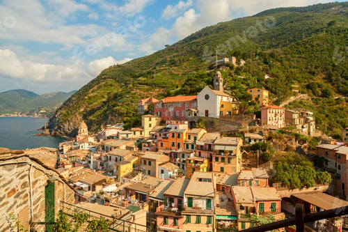 Preview: Aerial view of Cinque Terre National Park with colorful buildings against a green valley in Liguria