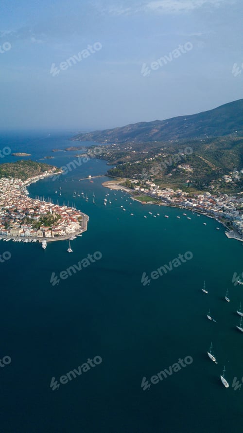 Preview: Vertical aerial shot of the beautiful island Poros, in Greece during daylight