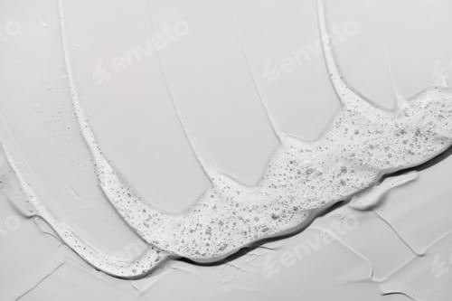 Visualização: Fundo
cinza cosmético abstrato em gel líquido. Mancha de produto hidratante transparente