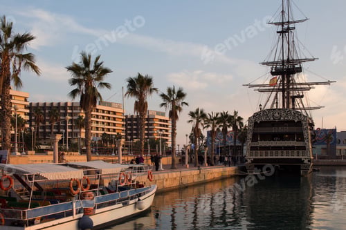Preview: a boat and a ship. sunset. palm trees. summer in the city. tropical vibe