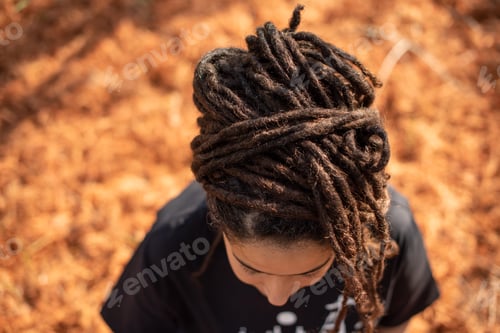 Preview: High angle shot of woman with locs hairstyle