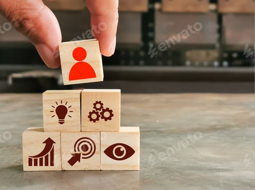 Preview: Leadership quality concept. Wooden cubes with icons and hand.