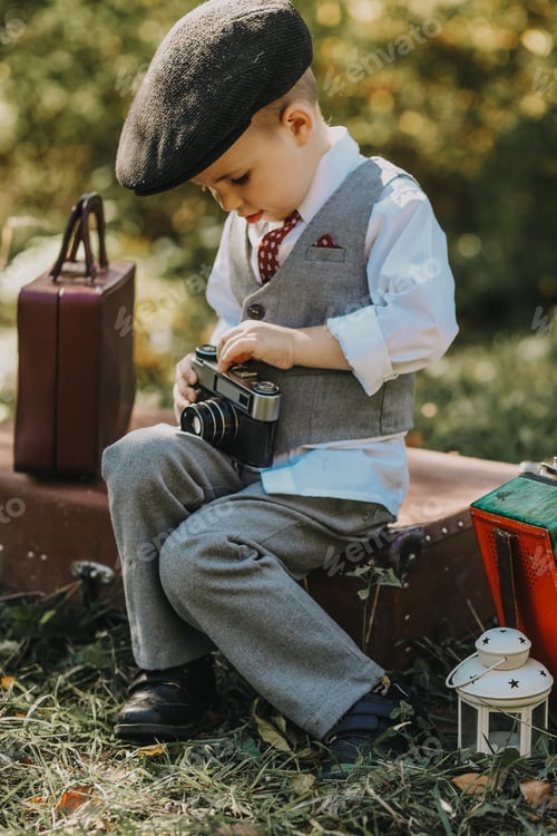 Preview: Little boy with an old camera