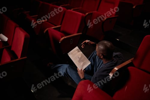 Preview: Artist Sitting on Floor in Theater
