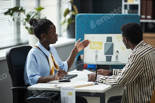 Preview: Black Female Consultant Explaining Digital Banking Services to Male Customer