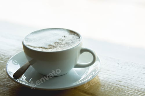 Preview: coffee cup on wood table in cafe coffee shop