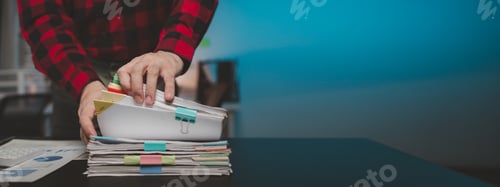 Preview: Office worker with stacks of documents, he is a startup company employee working in the office, work