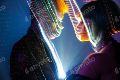 Preview: Traces of light on faces of couple