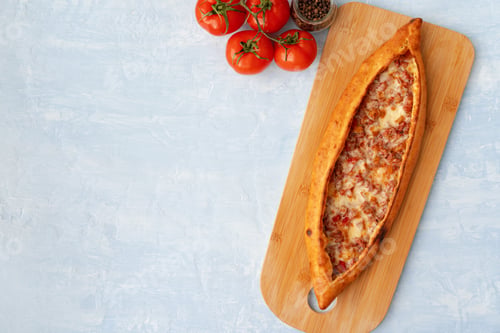 Preview: Turkish baked Pide bread on light blue wooden surface