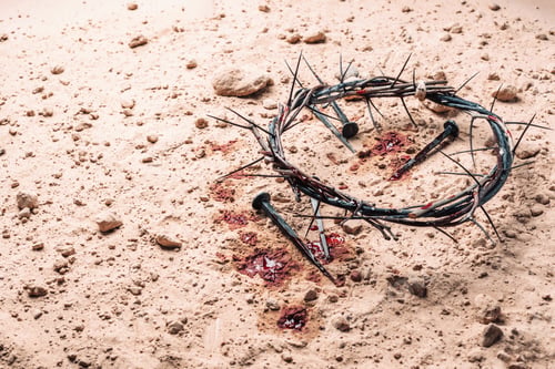 Preview: Crown of thorns, bloody nails on sand background. Good Friday, Passion of Jesus Christ. Christian