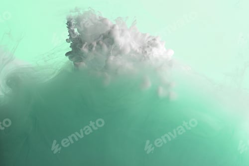 Preview: Close up view of green and white acrylic paint mixing in water