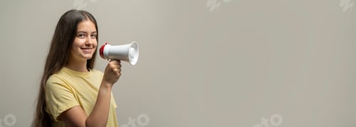 Preview: Girl holding megaphone for personal announcement with confident expression portrait
