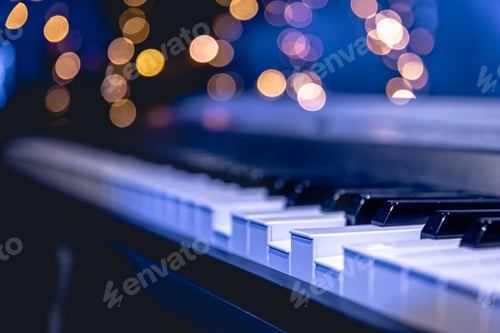 Preview: Piano keys close-up on a blurred background with bokeh.