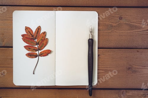 Preview: Autumn background template with notepad, blank pages of notepad, fountain pen and autumn leaves